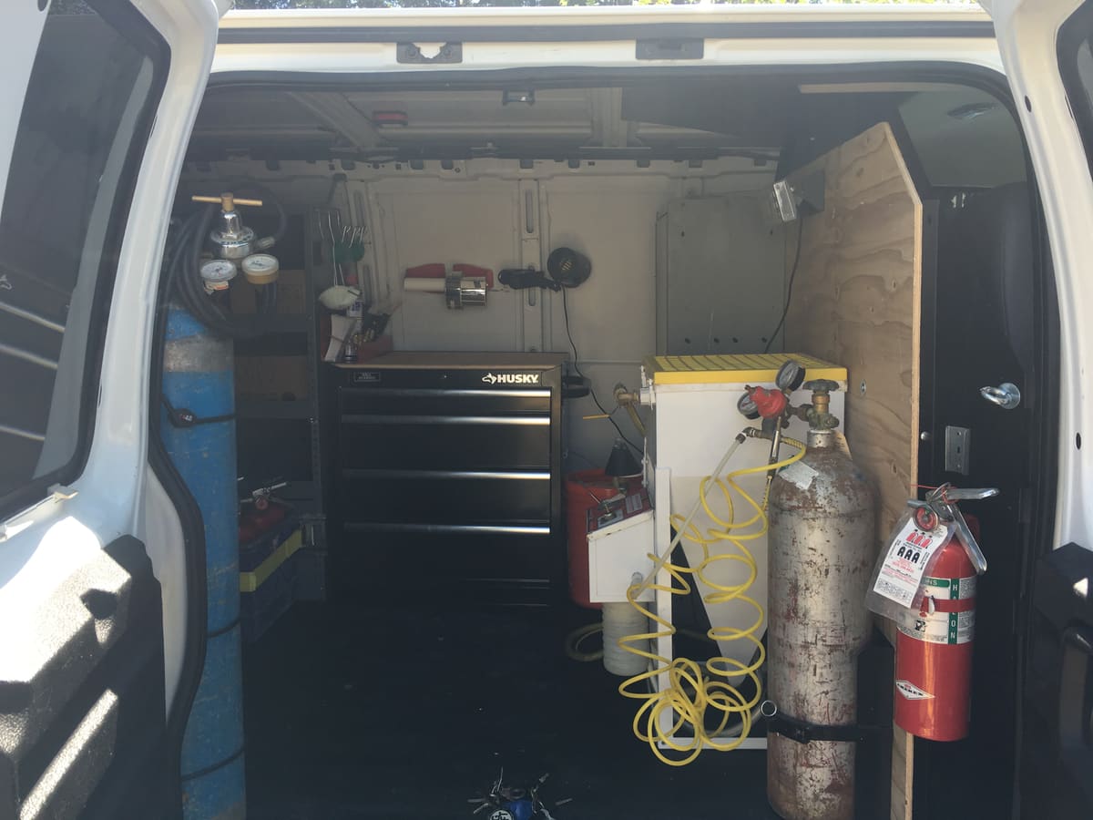 Inside an A+ service van: recharging station, tools and cylinders